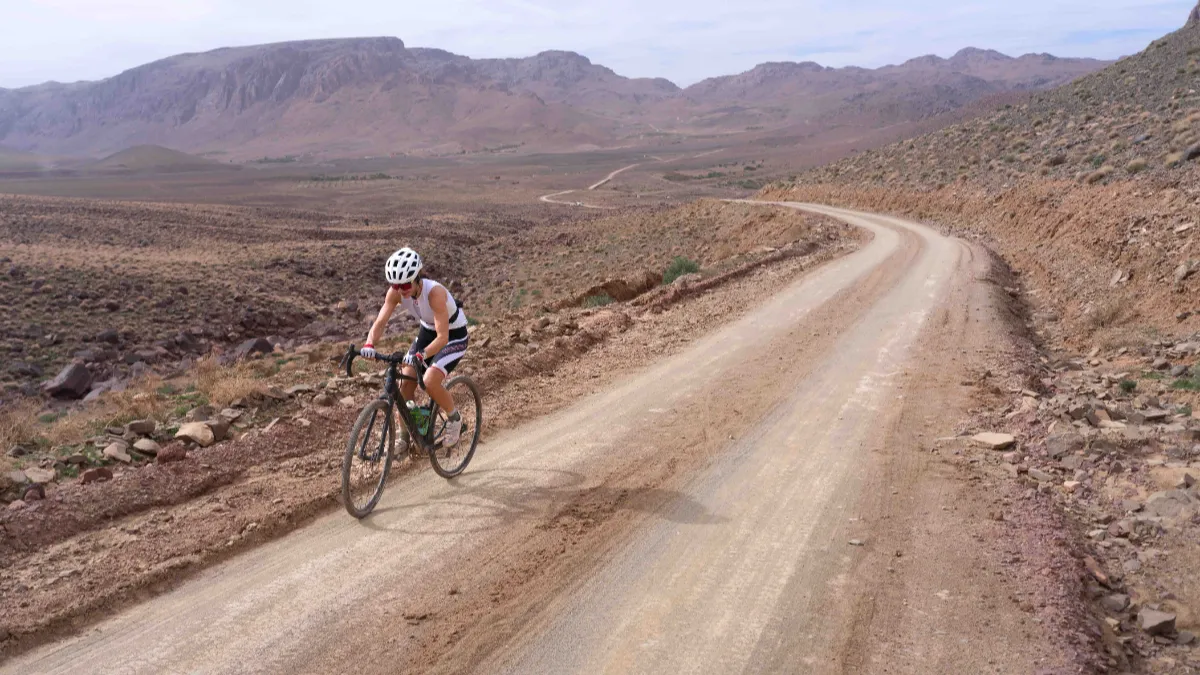 Mountain biker riding a rocky trail in the High Atlas Mountains, Morocco
