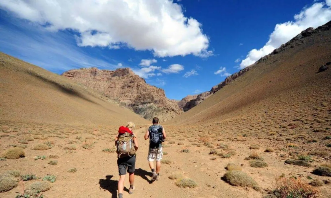 Hikers on a mountain path in the Atlas Mountains of Morocco