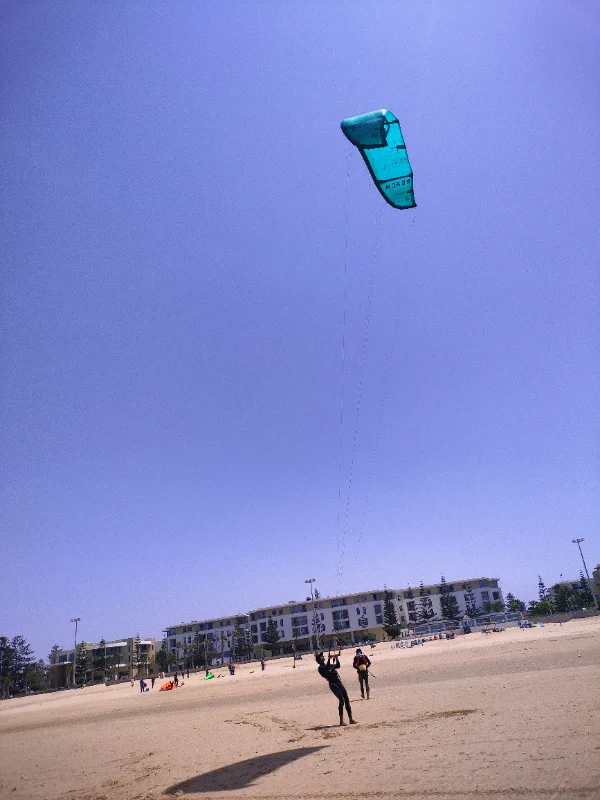 First steps: learning to fly the kite on the sand before going in the water.