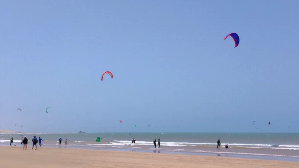 Afternoon wind on Essaouira's main beach, when the bay fills with kites.